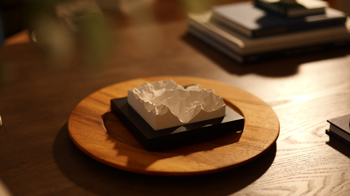 Mountain model on a table with decorations.