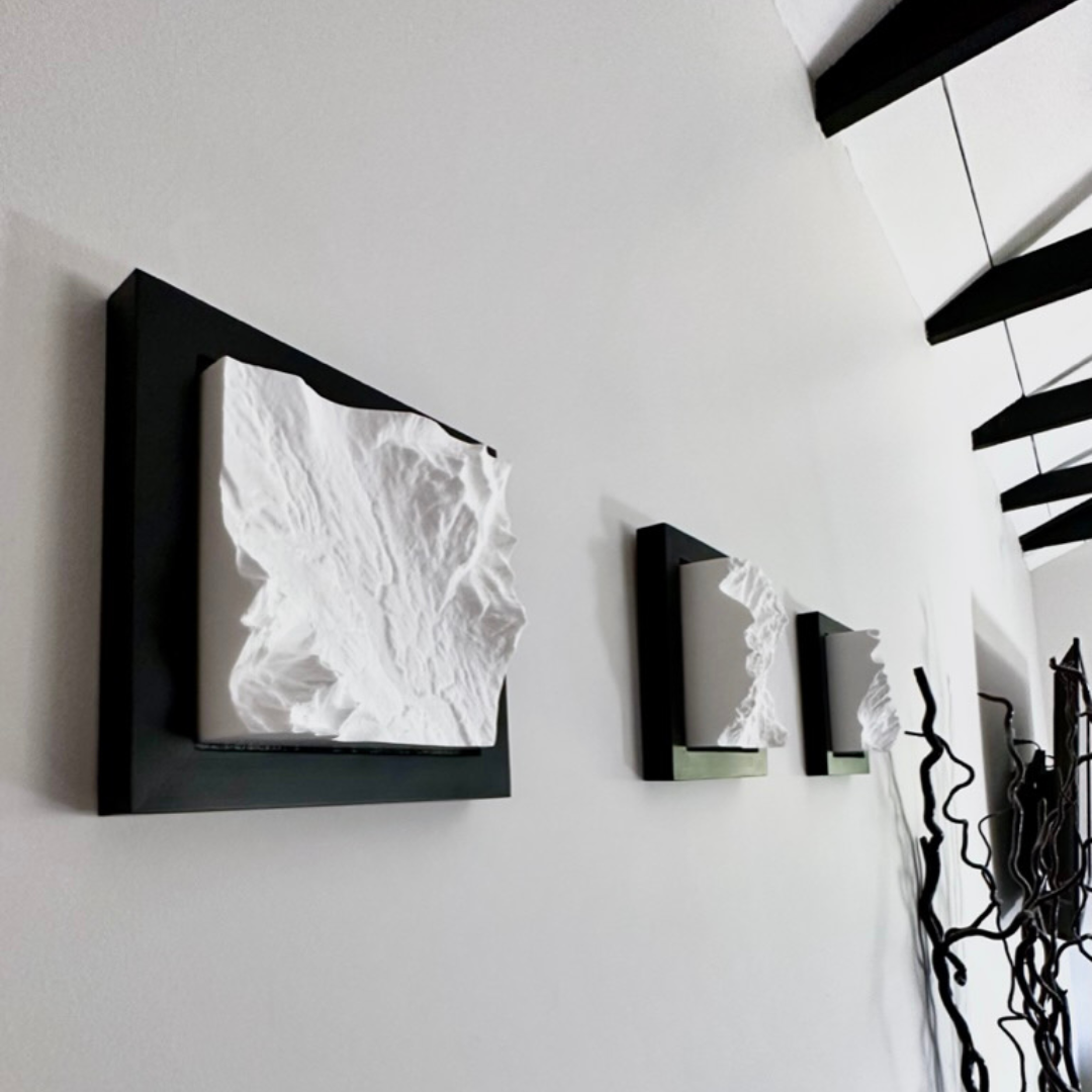 Frames hanging on a wall. 