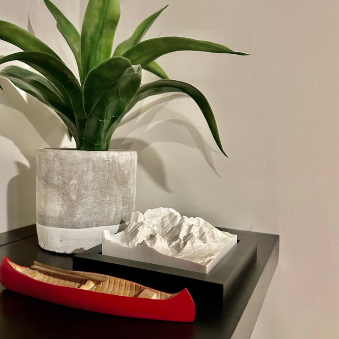 Lake Louise model sitting on a shelf with a red canoe. 