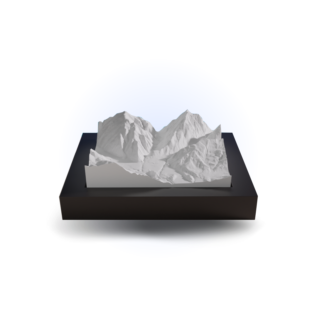 Model of a mountain range on a black base with a white background