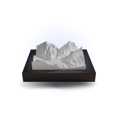 Model of a mountain range on a black base with a white background