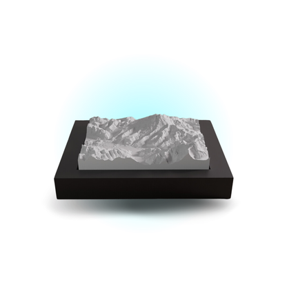 3D mountain model on a black base with a white background