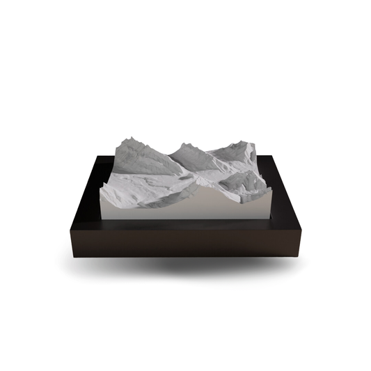 3D mountain model on a black base with a white background