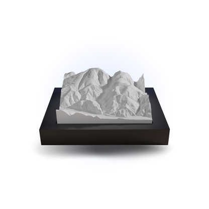 3D mountain model on a black base with a white background