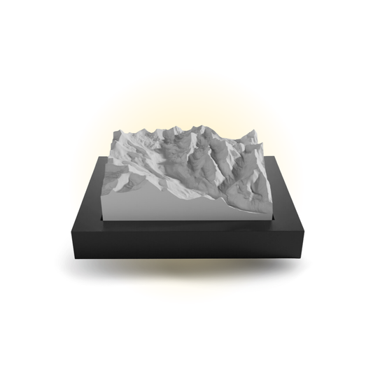 3D mountain model on a black base with a white background