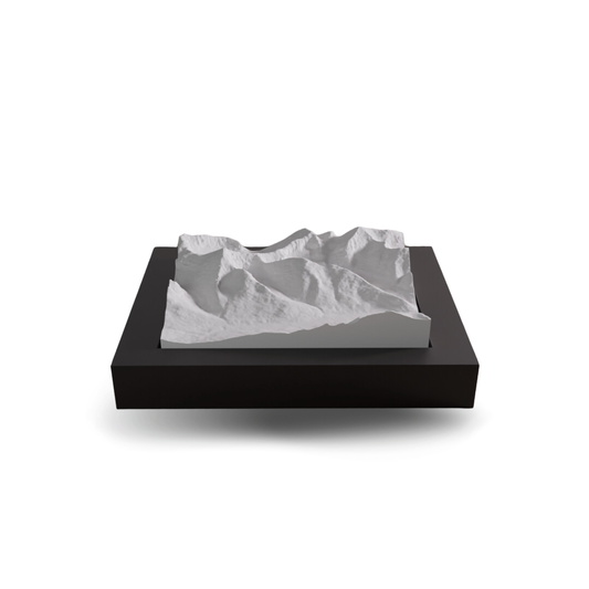 3D mountain model on a black base with a white background