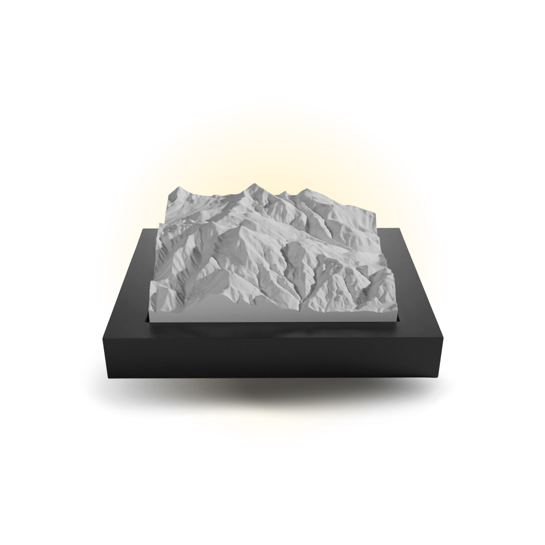 3D mountain model on a black base with a white background