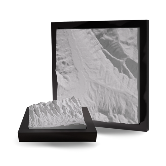 3D landscape model in a black frame on a white background