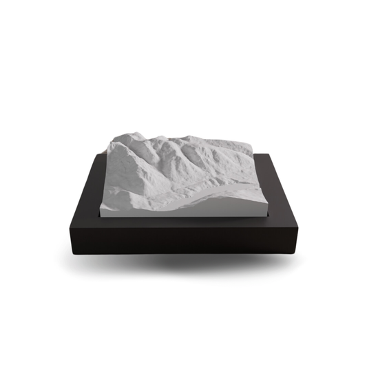 3D landscape model on a black base with a white background