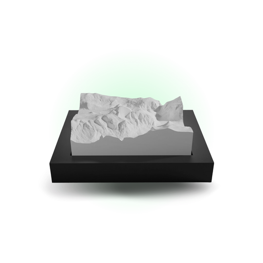 3D mountain model on a black base with a white background