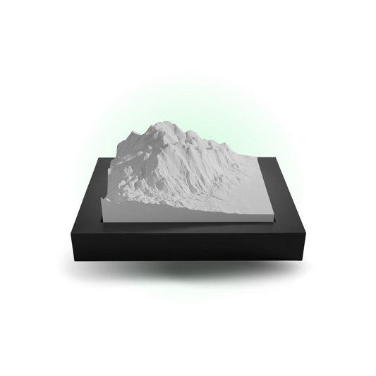 Model of a mountain on a black base with a white background