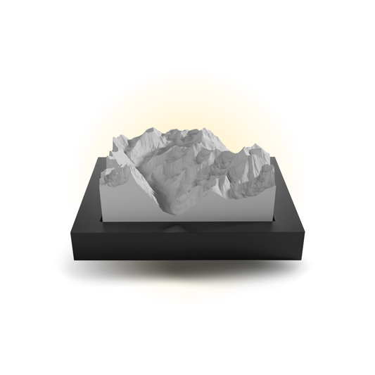 3D mountain model on a black base with a white background