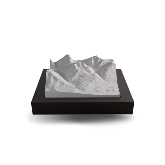 3D mountain model on a black base with a white background