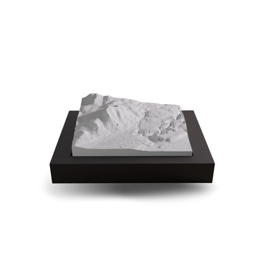 Marble-like material on a black base with a white background