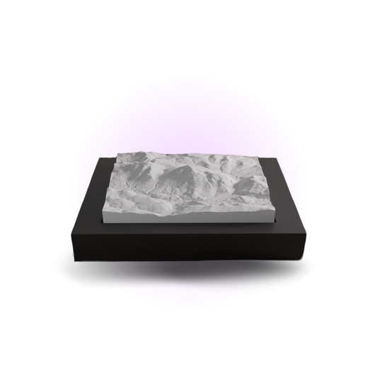 Marble-patterned object on a black stand with a white background