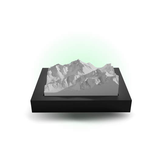 Mountainous landscape model on a black base with a white background