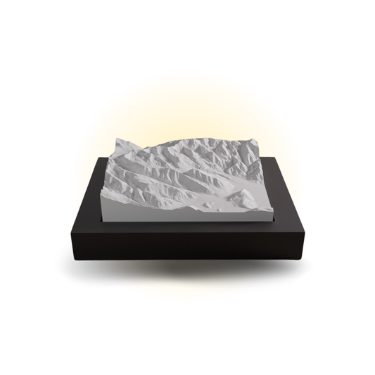 Decorative rock-like sculpture on a black base with a white background