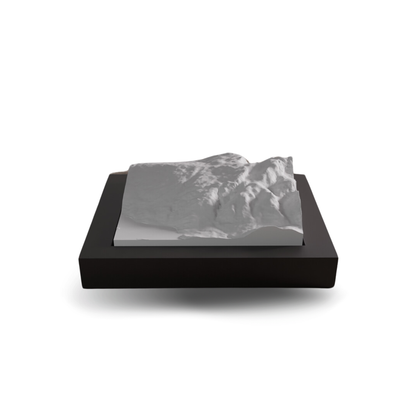 Marble-like material on a black base with a white background