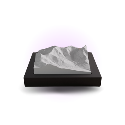 3D mountain model on a black base with a white background