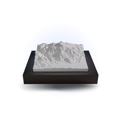 Topographic model of a mountain on a black base with a white background