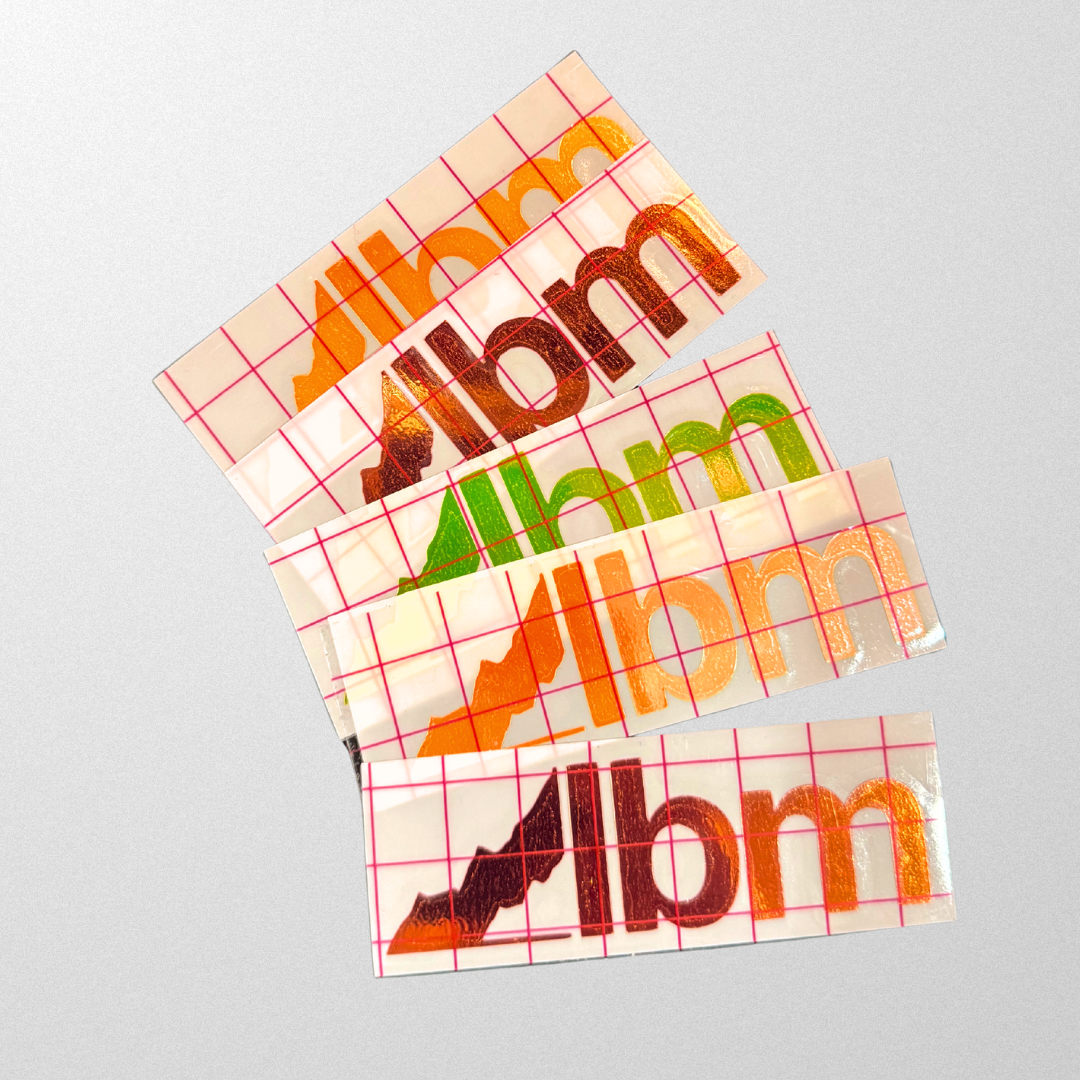 5 holographic stickers each with an lbm