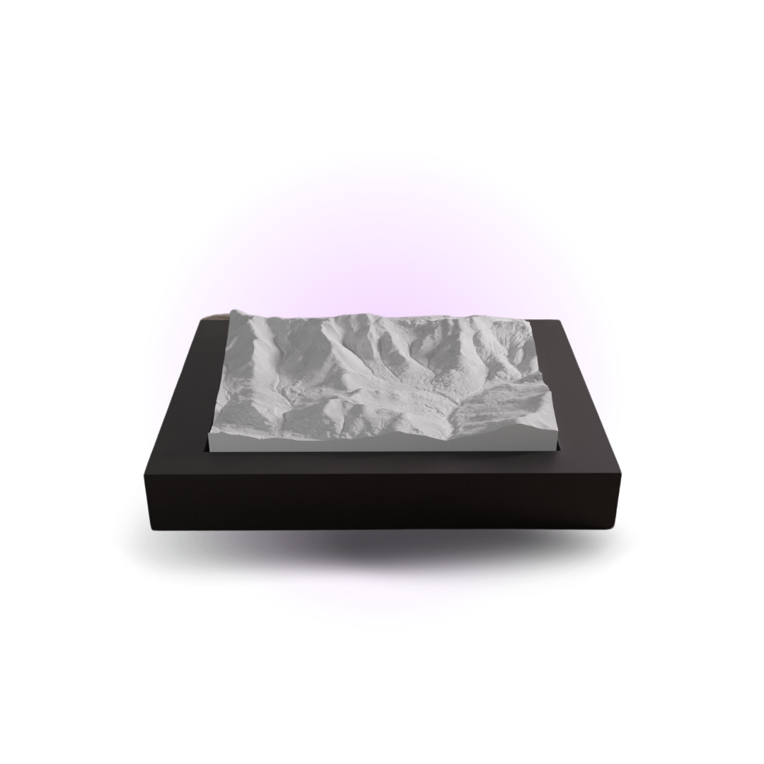 Black rectangular box with a gray marble-patterned lid on a white background