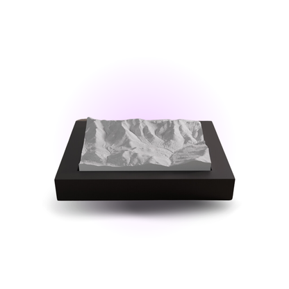 Black rectangular box with a gray marble-patterned lid on a white background