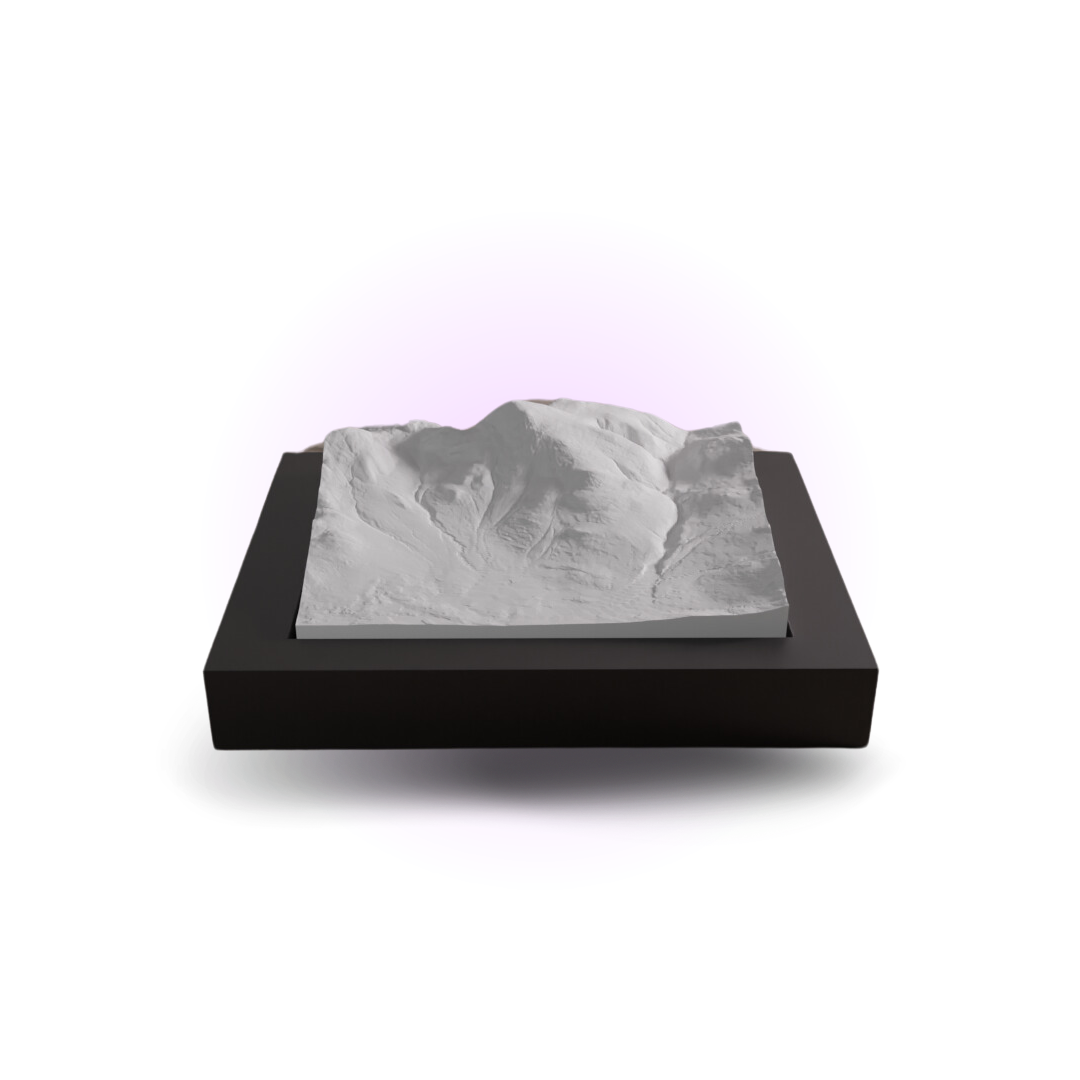 Model of a mountain on a black base with a white background