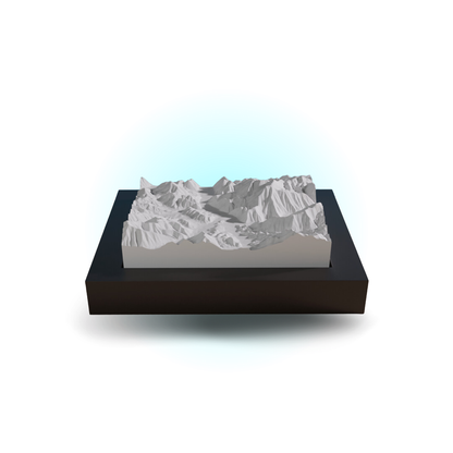 3D mountain model on a black base with a white background