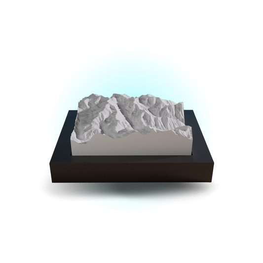 3D mountain model on a black base with a white background