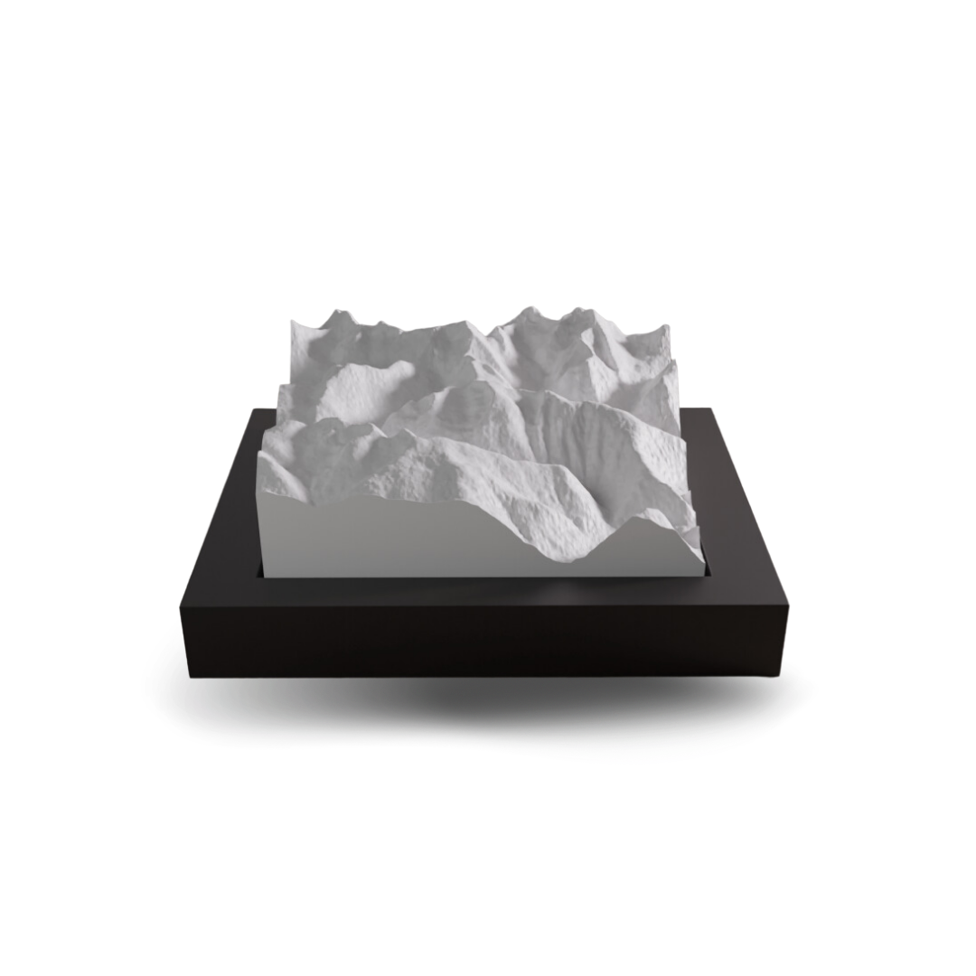 3D topographic model of a mountain on a black base with a white background