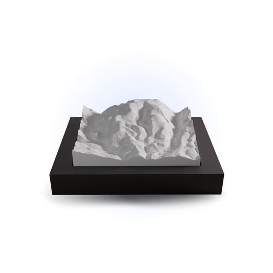 3D mountain model on a black base with a white background